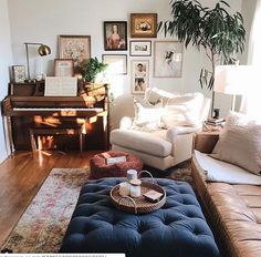 a living room filled with furniture and a piano