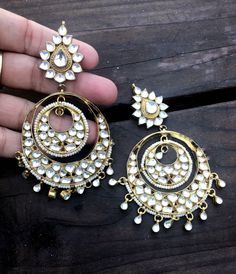 If you like to make a statement with your jewelry then this is the piece to own **Long chandelier earrings 4 inches long.from top of earring to tip of Earring. ** Gold vermeil- Made in pure .925 sterling silver and then 22 K Gold plated. **They are encrusted with original kundan glass stones which are used in 24 K Gold Jewellery. It takes around 2-4 weeks to hand make a piece like this. This is a designer One of a kind piece. Only made exclusively for royal exquisite jewelry lovers Thank you for White Chandbali Earrings For Reception, Fusion Chandbali Danglers For Wedding, Fusion Chandbali Wedding Danglers, Fusion Style Chandbali Danglers For Wedding, Fusion Style Chandbali Wedding Danglers, Fusion Style Chandbali Chandelier Earrings For Wedding, White Chandbali Bridal Earrings With Stone Work, Fusion Style Heavy Chandbali Bridal Earrings, Heavy White Chandbalis For Reception