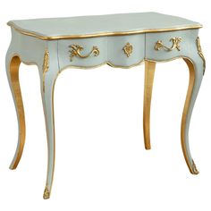 a blue table with gold trimmings and drawers on the top, against a white background