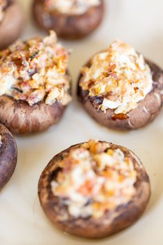 several stuffed mushrooms are sitting on a plate