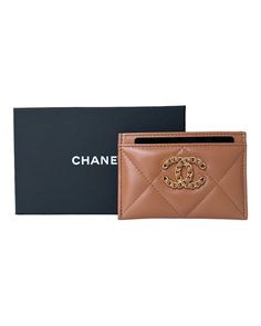 Authentic Chanel 19 Flat Card Holder, crafted from luxurious caramel lambskin leather and accented with elegant gold hardware. New, from 22A This sleek and stylish card holder measures 4.5" x 3" and is perfect for organizing your essential cards. Brand new and meticulously packaged, this item comes in its original box with a dust bag. This item is excluded from promotions & coupon codes. Luxury Tan Wallets With Interior Card Slots, Luxury Bag With Interior Card Slots And Rectangular Case, Luxury Designer Brown Card Holder, Designer Brown Card Holder For Gift, Designer Brown Card Holder As Gift, Luxury Evening Wallet With Leather Lining, Luxury Bifold Card Holder For Formal Occasions, Designer Brown Card Holder, Designer Leather Card Holder With Logo