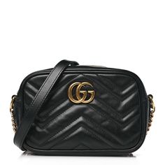 This is an authentic GUCCI Calfskin Matelasse Mini GG Marmont Chain Shoulder Bag in Black. This shoulder bag is crafted of smooth and supple calfskin leather in black with chevron quilting. The bag features an aged gold chain and black leather shoulder strap and a Gucci GG logo on the front. The top zipper opens to a beige microfiber interior with a flat pocket. Gucci Marmont Bag, Gucci Crossbody Bag, Gucci Crossbody, Small Messenger Bag, Gucci Marmont, Vintage Monogram, Gg Logo, Gucci Shoulder Bag, Gg Marmont