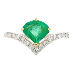 This is part of Chairish’s Fine Jewelry assortment.  Unique kite shape natural Colombian Emerald mounted in 18k gold and set on a curved regal band with luminous natural diamonds. This gorgeous ring has art deco inspirations and was handmade by our in-house jewelers. The rare fancy cut natural Colombian Emerald was sourced as a pair years ago from the famous Muzo mine in the Western Boyaca province of Colombia, near the Andes mountains.  ✔ Natural Emerald/Diamonds ✔ Gold Karat: 18k ✔ Available G Columbian Emerald Engagement Ring, Elegant Turquoise Emerald-cut Jewelry, Exquisite Gia Certified Emerald-cut Jewelry, Colombian Emerald Ring, Art Deco Inspiration, Andes Mountains, Gorgeous Ring, Colombian Emeralds, Wedding Band Sets