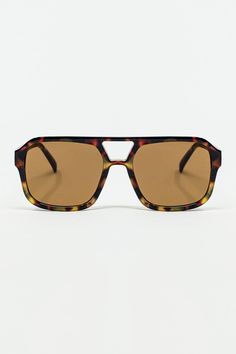 The 70's Aviator Sunglasses in Tortoise Shell offer a nostalgic nod to vintage style with their classic aviator shape. The tortoise shell frames bring a timeless, sophisticated touch, adding a warm and unique pattern that stands out effortlessly. Designed with 100% polycarbonate lenses, these sunglasses combine durability with a chic, retro flair.  Perfect for making a fashion statement while providing effective sun protection, these aviator sunglasses are versatile enough to complement any outfit, whether you're dressing up or keeping it casual.  The model, who stands 5'10" with measurements of 31 inches at the bust, 22 inches at the waist, and 35 inches at the hips, is wearing size U. These sunglasses are crafted to offer both style and comfort, ensuring they remain a fashionable and pra Shell Frame, Aviator Sunglasses, Tortoise Shell, Playsuit Jumpsuit, Unique Patterns, Dressing Up, Tortoise, Sun Protection, Occasion Wear