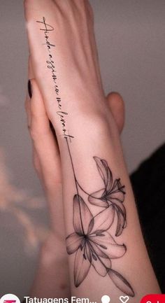 a woman's arm with a flower on it and the words, love is in the air