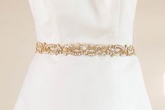 Gold and opal bridal sash rhinestone encrusted by EnrichbyMillie Gold Embellished Sashes For Wedding, Gold Embellished Wedding Sash, Elegant Gold Bridal Accessories With Sashes, Elegant Bridal Sashes, Elegant Bridal Sashes For Bride, Elegant Gold Bridal Belt For Bride, Elegant Gold Bridal Belt, Elegant Gold Sashes With Embroidered Belt, Gold Embroidered Bridal Belt For Wedding