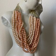 Vintage Torsade Necklace Chocker Small Beige & Peach Pink Freshwater Faux Pearls 1950’s. Pre-Owner. 8”Neck 9.5” Tong. This Necklace Is For Small Neck Was Made In Japan, As Looks Like One Row Is Missing And The Other Part Of The Clip. Look At The Last Pictures For Better Understanding. Wzancona Boutique’s Collections. As It Is. Understand The Meaning Of Antiques And Vintage. Elegant Pink Necklace For Summer, Pink Multi-strand Necklace For Parties, Elegant Beige Necklaces For Summer, Elegant Beige Necklace For Summer, Elegant Pink Pearl Necklace For Party, Vintage Pink Pearl Necklaces, Elegant Coral Necklaces For Parties, Pink Pearl Beaded Necklaces For Parties, Ear Cuffs