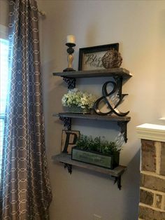 an image of a shelf with flowers in it on the wall next to a window