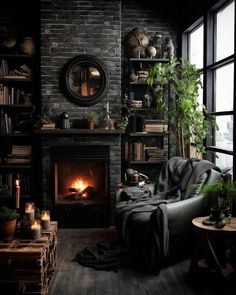 a living room with a fire place and bookshelves on the wall next to it