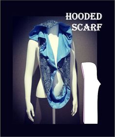 a white mannequin wearing a blue scarf