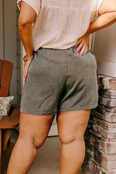 - Keep it casual in these trendy shorts! - Lightweight unlined material - A high elastic waistline with a faux drawstring accent tie - A faux zip fly accent - Functional side pockets as well functional low cargo style pockets - A relaxed silhouette that ends in straight mid-thigh length hemlines Measurements XL : Front Rise 17", Hip 42", Inseam 3.5", Length 17.5", Waist 36-40". 1XL : Front Rise 17", Hip 44", Inseam 4", Length 18", Waist 38-42". 2XL : Front Rise 17.5", Hip 46", Inseam 4.5", Lengt Khaki Drawstring Shorts, Casual Olive Bottoms Short Length, Casual Olive Short Bottoms, Casual Olive Short Length Bottoms, Khaki Drawstring Bottoms Of Short Length, Khaki Drawstring Bottoms Short Length, Khaki Short-length Bottoms With Drawstring, High Waist Shorts, Cargo Style