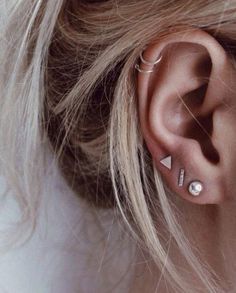 a woman with ear piercings on her ears