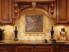 a kitchen with wooden cabinets and tile backsplash in the center, surrounded by granite counter tops