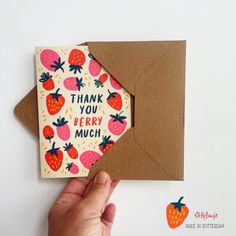 a hand holding up a card that says thank you berry much with strawberries on it