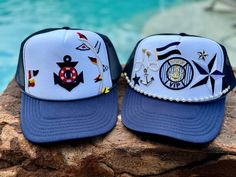 These nautical themed trucker hats are one of a kind and beyond adorable for a day at sea. One size fits most; SnapBack style. Circumference is approximately 22-24" Navy Snapback Trucker Hat For Summer, Adjustable Nautical Hats For The Beach, Nautical Style Beach Hat With Curved Brim, Nautical Beach Hat With Curved Brim, Nautical Hat With Adjustable Fit And Curved Brim, Adjustable Nautical Beach Hat, Nautical Hat With Adjustable Curved Brim, Nautical Style Cap For Boating, Navy Snapback Hats For Beach