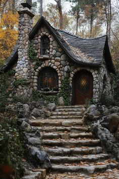 a stone house with steps leading up to it