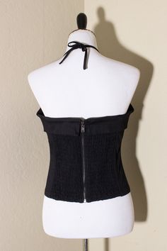 This stunning bustier top features black cotton fabric with padded cups, boning and elastic shirring on the back for a perfect fit! Zip up back with a cute V tie. Also did you notice the cute fold over bustline? 100% cotton with lining. Imported. Cute V, Black Cotton Fabric, Bustier Top, Fold Over, Black Cotton, Final Sale, Strapless Top, Zip Ups, Perfect Fit