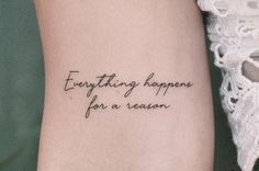 a woman with a tattoo saying everything happens for a reason on her left arm,