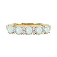 a yellow gold ring with white opal and diamonds