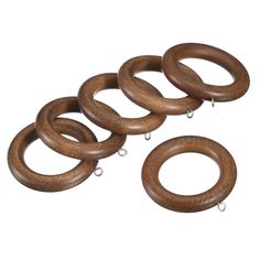 six wooden rings are shown on a white background