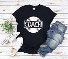 "* All shirts are unisex. * Product measurements may vary by up to 2 inches. * All Designs are originally made by myself or my team.  Baseball shirt with the quote \"Coach\" is a fun gift for men and women!  To see more designs of your topic Baseball you can search & find them in the store:   https://www.etsy.com/shop/Retailorie  You find there also an announcement if the shipping & production times change :) best coach ever,best baseball coach,baseball coach gift,baseball shirt,baseball player gift,baseball team shirt,baseball coach shirt,baseball gift,baseball t-shirt,baseball t shirt,baseball tshirt,sports shirt,athlete shirt," Casual T-shirt With Heat Transfer Vinyl For Sports Events, Baseball Season T-shirt With Heat Transfer Vinyl, Sports Fan T-shirt With Heat Transfer Vinyl, Relaxed Fit T-shirt With Team Name For Baseball Season, Sports Season T-shirt With Heat Transfer Vinyl, Heat Transfer Vinyl Sports T-shirt, Heat Transfer Vinyl T-shirt For Sports Season, Short Sleeve Sports T-shirt With Heat Transfer Vinyl, Sporty Short Sleeve T-shirt With Heat Transfer Vinyl