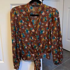 Nwot Zara Floral Blouse Size Xs. No Flaws. Polyester. Gold Button Front With Tie. 21” L 18” Chest And 14” Hemline Brown Printed Tops For Spring, Zara Brown Blouse For Spring, Brown Floral Print Long Sleeve Tops, Brown Floral Print Long Sleeve Blouse, Brown Floral Print Tops For Fall, Brown Long Sleeve Floral Print Tops, Brown Zara Blouse For Summer, Zara Floral Print Tops For Fall, Zara Printed Blouse For Fall