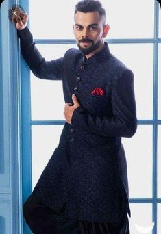 Kindly Get In Touch For Any Color Or Customization Virat Kohli Bollywood Replica Rayon Jacquard Self Weaved Dark Blue & Black Blend  8 Polyester Button   Attributes  *Indo Western Sherwani - Rayon Jacquard Self Weaved Dark Blue & Black Blend    *8 Polyester Button *Bottom  Pure Cotton Silk Patiyala 1.  Pls Select Your Size As per Your Body Chest Size as given in Image Section 2.  Kindly Get In Touch In Case Of Custom Stitching @ 20 USD Additional Thank You for Visiting Blue Unstitched Suit With Dabka For Reception, Blue Traditional Nehru Jacket For Receptions, Blue Nehru Jacket For Reception With Traditional Drape, Bollywood Style Blue Nehru Jacket For Reception, Traditional Wear With Zari Work For Winter Reception, Blue Bollywood Nehru Jacket For Reception, Traditional Blue Bandhgala With Naqshi, Blue Bandhgala With Naqshi For Formal Occasions, Formal Blue Sherwani With Naqshi Detailing