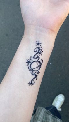 a person with a tattoo on their wrist