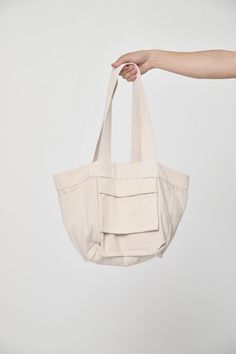 The perfect shoulder-strapped companion for any adventure. This tote is well-proportioned and reversible, with four useful pockets which can be inside or flipped for easy access. Made from a unique blend of recycled scraps and sustainably sourced cotton, developed in partnership with a family factory in Colombia that supports a fair-wage workforce and closed-loop supply chain. Details Unisex Great as a weekender or carry-on bag Reversible, with internal or external pockets 9.5 oz Woven Bull Deni On-the-go Hobo Bag With Pockets, Everyday Utility Bag With Removable Pouch, Functional Everyday Shoulder Bag With Side Pockets, Double Handle Shoulder Bag With Functional Pockets For On-the-go, Utility Shoulder Bag For Daily Use, Everyday Utility Bags With Functional Pockets, Eco-friendly Canvas Bag With Pockets, Functional Shoulder Bag With Multiple Pockets For Everyday, Eco-friendly Canvas Bags With Pockets