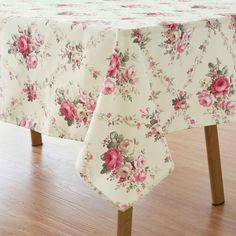 the table cloth has pink flowers on it