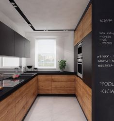 an image of a kitchen with black and white counter tops, wood cabinets, and chalk writing on the wall