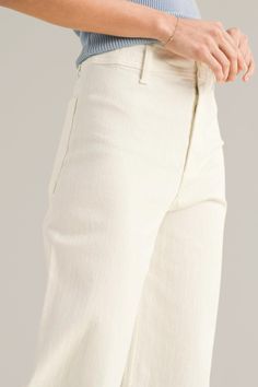 upgrade your casual wardrobe with these zara-dupe, cream wide-leg cut-off denim pants, a versatile blend of comfort and contemporary style. crafted from premium denim with stretch, these pants feature a flattering high-rise waist and a wide-leg silhouette that offers a relaxed, yet chic look. pairs effortlessly with both casual tees and dressier tops. finished with a cut-off hem for a modern edge, these pants are ideal for creating effortless day-to-night outfits. 98% cotton | 2% spandex back po Beige Relaxed Fit Flare Jeans For Spring, Beige Wide Leg Pants With Five Pockets, Beige Wide Leg Flare Jeans For Work, Casual Beige Flare Jeans For Summer, High Rise Cotton Wide Leg Pants With Frayed Hem, Wide Leg Flare Jeans In Beige With Five Pockets, Relaxed Fit Cotton Wide Leg Pants With Frayed Hem, Chic Relaxed Fit Cropped Wide Leg Pants, Beige Wide-leg Jeans With Five Pockets