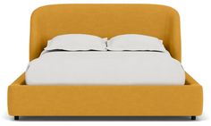 an orange bed with white sheets and pillows