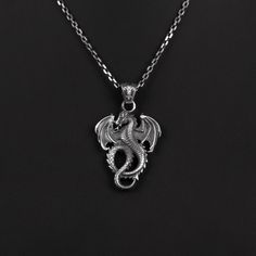 Winged Dragon Silver Man Necklace, Mens Dragon Pendant With Chain, Oxidized Silver Dragon Gift Pendant, Medieval Dragon Silver Men Pendant *  Item Details * Gender : Male / Female * Material : 925 Sterling Silver * Pendant Weight : 5 Grams * Chain Length 18 Inches - (45cm)  20 Inches - (50cm)  22 Inches - (55cm)  24 Inches - (60cm)  26 Inches - (65cm)  28 Inches - (70cm)  ✔ Ready to Ship in 1-3 Business Days ✔ Shipped to the worldwide 1-5 business days with free shipping. ✔ The product will be s Collectible Black Stainless Steel Necklace, Collectible Silver Necklace With Dragon Design, Male Necklace, Necklace Dragon, Man Necklace, Medieval Dragon, Wings Pendant, Men Pendant, Silver Dragon Necklace