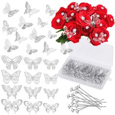 red roses and butterflies in a clear box with silver studs on the side, surrounded by other metal pins