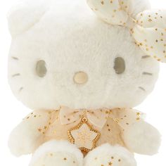 a white hello kitty stuffed animal with gold stars