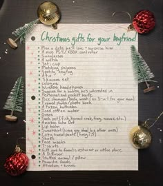 a christmas gift list with ornaments around it