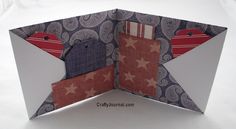 an origami folded card with red, white and blue designs