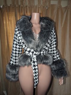 This Houndstooth Poncho from Primadons and Donnas is an oversized faux fur coat with a hood. It is made of a first class quality faux fur fabric, available in many colors. Soft and romantic, this style of coat is perfect for any occasion, from parties to traveling to shopping. The size of the poncho is 180cm*75cm. If you would like to customize the color, please choose the 'custom color' option and place the color you want in the order notes. Fall Outerwear With Faux Fur Trim, Fall Faux Fur Outerwear With Feather Trim, Cozy Fall Fur Coat With Faux Fur Trim, Fall Faux Fur Coat With Faux Fur Trim, Fall Faux Fur Hooded Coat, Fall Hooded Faux Fur Coat, Fall Fur Coat With Feather Trim For Cold Weather, Winter Faux Fur Coat With Feather Trim, Winter Feather Trim Fur Coat