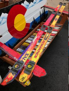 an airplane made out of skateboards sitting on the ground