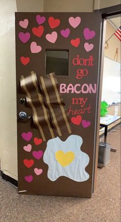 a door decorated with hearts and bacon for valentine's day at an office building