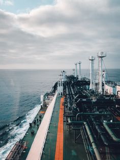 an oil tanker ship in the middle of the ocean with large pipes on it's side