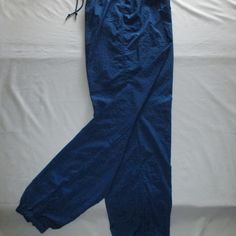 Nike Leisure Pants - Royal Blue - (M 8-10) Nwot Nike Leisure Pants With Drawstring Elastic Waist, Zipper On Each Lower Leg With Elastic Hem, Three (3) Pockets; One On Each Side With An Additional Tab Velcro Inner Pocket To Secure Keys, Cash, And I.D.; Can Be Worn Over Swim/Workout. Size M/8-10. Approx. Measurements Are: 25 ¼” Around/Diameter Without Elastic Stretch, Stretch To 16” Flat (32”), Hips 22” Flat (44”), Inseam 31 ½”, Ankle Zipped With No Stretch 10 ¼” Around/Diameter, Zipper On Leg 12” Blue Full Length Sweatpants With Pockets, Nike Bottoms With Pockets, Nike Full-length Bottoms With Pockets, Nike Stretch Cotton Sweatpants, Nike Long Bottoms With Pockets, Nike Relaxed Fit Full Length Bottoms, High Waist Blue Sweatpants With Elastic Waistband, Nike Stretch Bottoms For Spring, Nike Tapered Leg Bottoms With Pockets