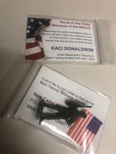 a pair of black plastic scissors sitting on top of a white table next to an american flag