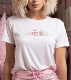 Step into the world of whimsy with our Coquette Charm Women's Tee! This delightful shirt features a collection of cute coquette designs - bows, cherries, vintage purse, umbrella, and shoes, all in a playful arrangement. Available in white, Solid Natural, and Light Pink, this tee is perfect for those who adore the coquette aesthetic. Embrace the charm and elegance of this custom-designed shirt, crafted for comfort and style. Make a statement with our Coquette Charm Women's Tee and let your fashion speak volumes.  #CoquetteStyle #WhimsicalFashion #CharmingTee Cute Coquette Tee, Coquette Y2K Top, The Boyfriend Tee for Women, Cute Y2K Shirt, Trending Shirts, Y2K 90s 2000s clothing, Coquette Clothing This feminine cut classic tee provides a fashionably casual look. A signature style from Next L White Y2k T-shirt With Anime Print, White Y2k Anime Print T-shirt, White Y2k Shirt For Spring, White Harajuku Style Screen Print Shirt, White Harajuku Shirt With Graphic Print, White Harajuku Shirt With Screen Print, White Harajuku Top With Screen Print, Kawaii Screen Print Tops For Summer, Kawaii Summer Top With Screen Print