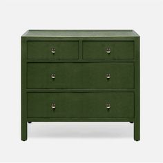 a green dresser with three drawers and two knobs on the bottom, in front of a white background