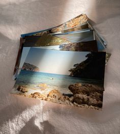 three photos are placed on top of each other near the water and rocks in front of them