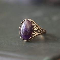 14 x 10mm cabochon on an antiqued sterling silver plated or brass adjustable ring. Easy to adjust to any size. Choose from Rose Quartz, Amethyst or Rhodonite. Vintage Purple Oval Cabochon Jewelry, Vintage Amethyst Oval Cabochon Ring, Antique Oxidized Ring As Gift, Antique Oxidized Finish Ring For Gift, Antique Oxidized Finish Ring Gift, Vintage Sterling Silver Crystal Cabochon Ring, Vintage Sterling Silver Cabochon Crystal Ring, Bronze Gemstone Vintage Jewelry, Vintage Oval Cabochon Crystal Ring