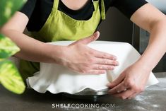 a woman in an apron is holding onto a white pillow with the words $ 20 off now $ 29 99 with coupon code