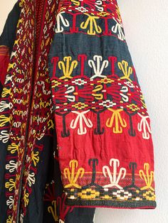 Fantastic traditional Turkmen robe/duster. Vivid colors and carefully embroidered workmanship. One of the best examples of this type of traditional wear we have come across. Infinitely wearable and looks great with jeans and boots. Add flair to a jeans and t uniform. Fabric: cotton/silk/ otherFit: S/MEra: 1940's Measurements: Bust 48" Sleeve (from collar) 32" Length 43" Waist 48" Hips 52" Condition: Excellent Traditional Multicolor Embroidered Kimono For Fall, Traditional Cotton Tunic Kimono, Traditional Fall Kimono With Multicolor Embroidery, Traditional Embroidered Kimono For Fall, Folk Style Embroidered Multicolor Kimono, Folk Style Kimono With Multicolor Embroidery, Traditional Embroidered Fall Kimono, Traditional Multicolor Embroidered Geometric Kaftan, Traditional Kaftan With Geometric Embroidery For Festivals